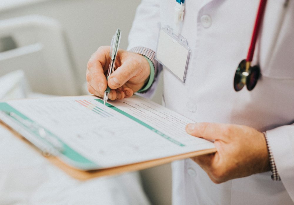 physician-noting-down-symptoms-patient physician-noting-down-symptoms-patient